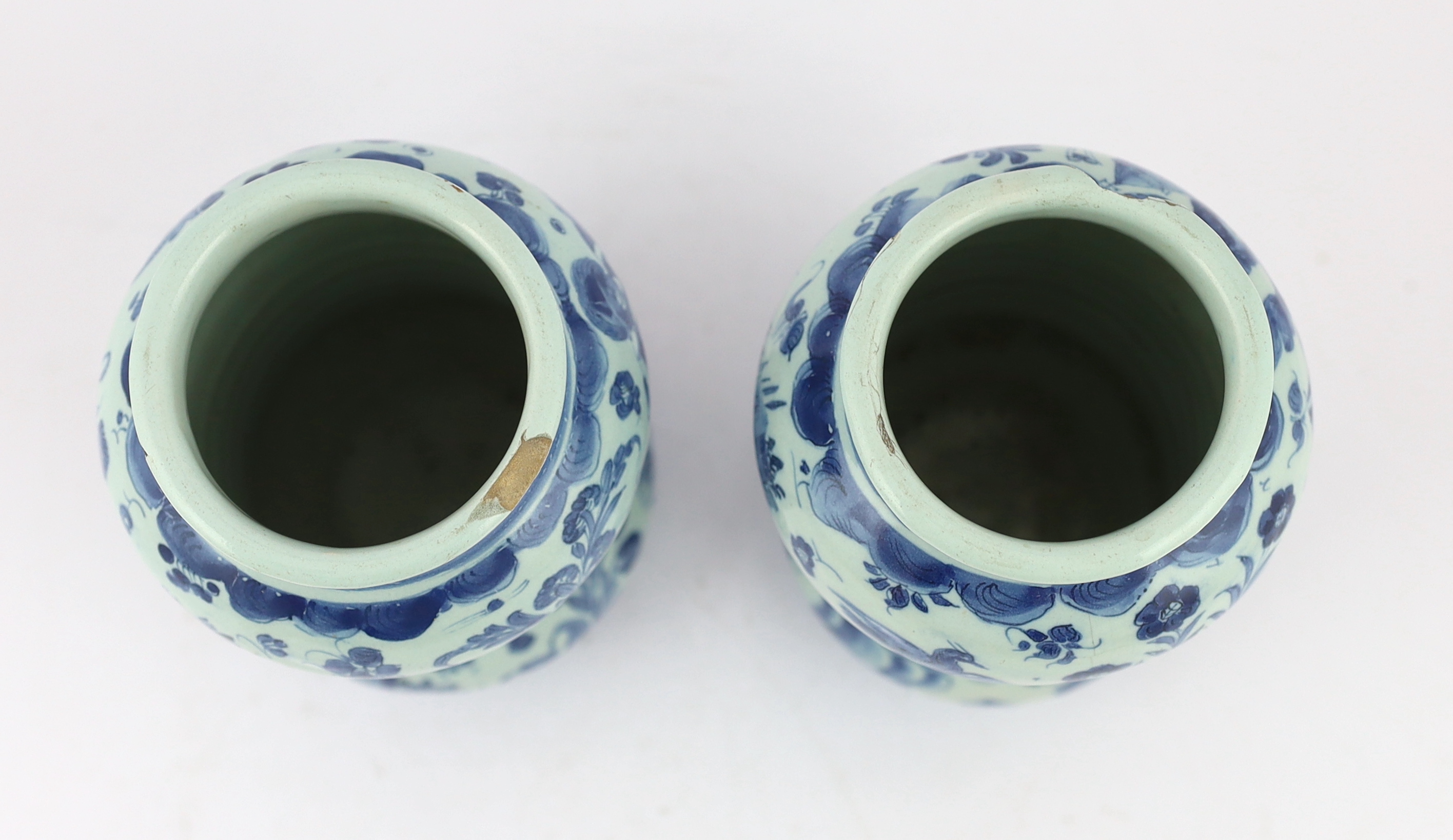 A pair of Italian blue and white maiolica albarellos, Savona, late 17th century, glaze losses, latter chipped